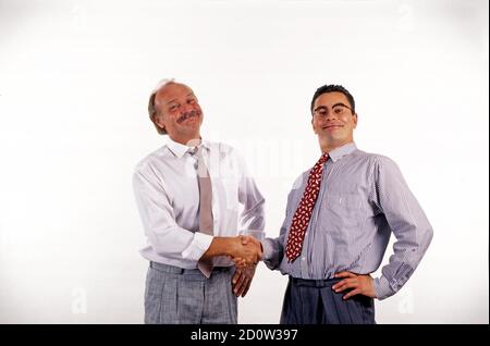 Uomini d'affari scuotono le mani, divertente, grin, Berlino, Germania, Europa Foto Stock