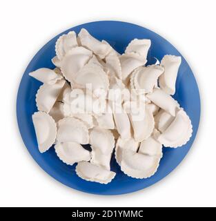 Gnocchi surgelati su una piastra blu. Vista dall'alto. Foto Stock