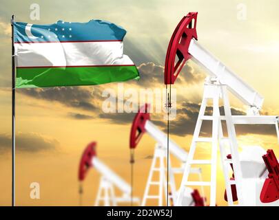 Le piattaforme petrolifere sullo sfondo del cielo colorato e di un flagpole con la bandiera dell'Uzbekistan. Il concetto di produzione di petrolio, minerali, sviluppo di Foto Stock