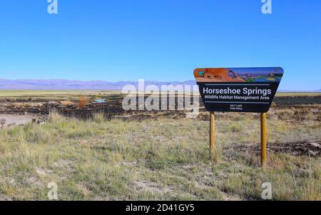 HORSESHOE SPRINGS, UTAH, STATI UNITI - 22 giu 2018: Un segno segna Horseshoe Springs nella Skull Valley dello Utah, una sorgente naturale di acqua dolce all'interno di un Wil Foto Stock