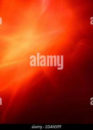 Immagine di un motivo di texture sfocata rosso-arancione non focalizzato per uno sfondo astratto Foto Stock