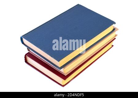 pila di tre libri isolati su sfondo bianco Foto Stock