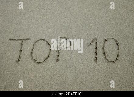 Il segno top 10, scritto sulla spiaggia di sabbia Foto Stock