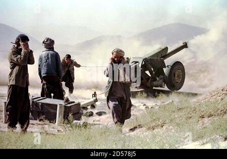 Afghan Islamic Taliban fighters fire a soviet-made cannon, 25 km north of the Afghan capital November 2. Sporadic exchanges of artillery and rocket fire have continued between the Taliban and the former government forces deadlocked in a range of hills across the Shamali valley for two weeks.