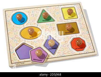 Puzzle di forma per bambini fotografati su sfondo bianco Foto Stock