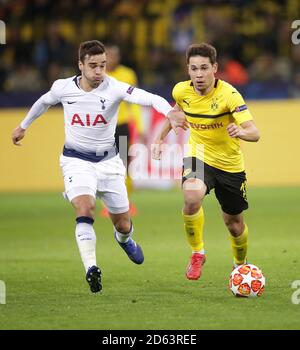 Harry Winks di Tottenham Hotspur (a sinistra) e Raphael Guerreiro di Borussia Dortmund in azione Foto Stock