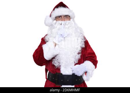 Uomo anziano che indossa un costume tradizionale di Sant Claus con un dito sollevato alle labbra facendo gesto di Shh. Foto Stock