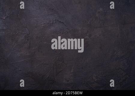 Cemento nero scuro colore sfondo testurizzato, pietra cemento disegno loft parete Foto Stock