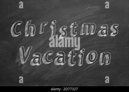 Testo di disegno a mano Natale vacanza su lavagna Foto Stock