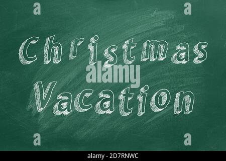 Testo di disegno a mano vacanza di Natale su lavagna verde Foto Stock