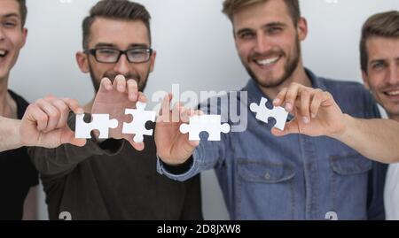Immagine dei ragazzi del collegamento di pezzi del puzzle Foto Stock