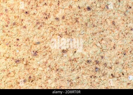 Un vecchio sfondo di pietra giallo, con intemperie. Foto Stock