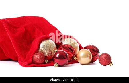 Borsa di Babbo Natale piena di belle decorazioni natalizie su bianco sfondo Foto Stock