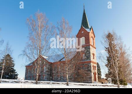 L'esterno della Chiesa di Juva durante la soleggiata giornata invernale. Regione della Savonia meridionale della Finlandia Foto Stock