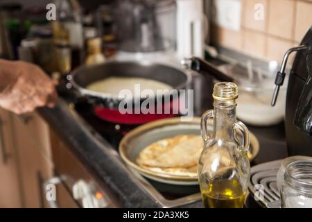 cooking at home: making French crepes in the pan for a festive breakfast Stock Photo
