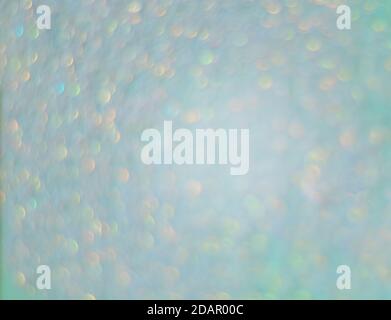 Sequine verde chiaro, sfondo astratto offuscato Foto Stock