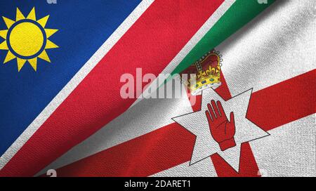Namibia e Irlanda del Nord due bandiere tessuto, tessuto Foto Stock