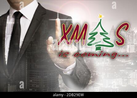 XMAS è mostrato dal concetto di uomo d'affari. Foto Stock