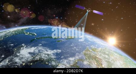 Il satellite trasmette un segnale alla terra sullo sfondo del sole. Rendering 3D. Elementi di questa immagine fornita dalla NASA. Foto Stock