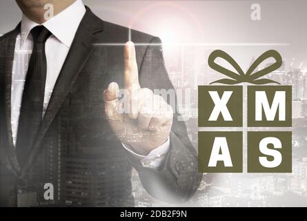 IL regalo DI NATALE è mostrato dal concetto dell'uomo d'affari. Foto Stock