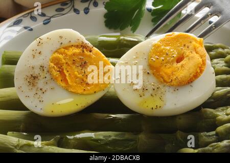 Boiled eggs with green asparagus Stock Photo