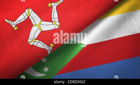 Isle of Mann e Comoros due bandiere tessuto tessuto, tessuto Foto Stock