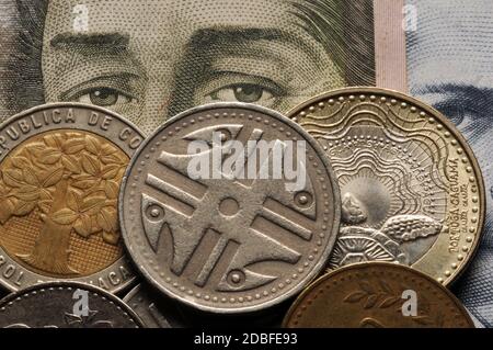 Closeup on colombian banknote and coins Stock Photo