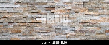 Muro in pietra di pietra luminosa - dettaglio panoramico Foto Stock