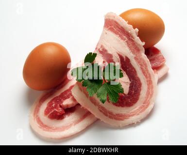 Fette di pancetta con due uova Foto Stock