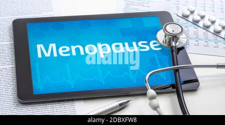 La parola Menopause sul display di un tablet Foto Stock