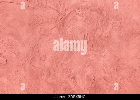 Corallo rosa a basso contrasto con fondo testurizzato in cemento Foto Stock