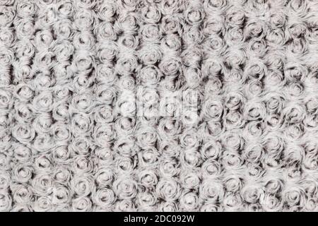 Background e texture di grigio pellicce artificiali con i riccioli di round. Close-up Foto Stock