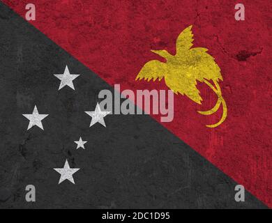 Bandiera di Papua Nuova Guinea su cemento intemperie Foto Stock