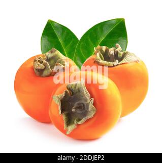 Tre persimmons maturi con foglie verdi Foto Stock