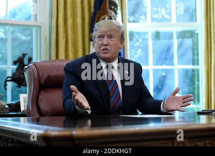 Il presidente DEGLI STATI UNITI Donald Trump annuncia che il Guatemala sta firmando un accordo per limitare le domande di asilo agli Stati Uniti dall'America centrale nell'ufficio ovale alla Casa Bianca a Washington, D.C., il 26 luglio 2019. Foto di Olivier Douliery/ABACAPRESS.COM Foto Stock