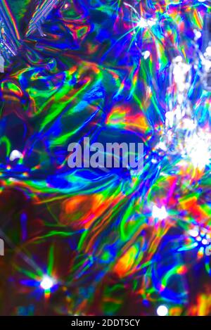 Olografico sfocato sfocato iridescente astratto colorato sfondo festivo. Foto Stock