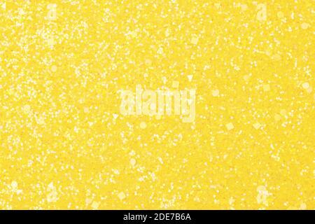 Olografico giallo brillante glitter sfondo a trama reale. Foto Stock