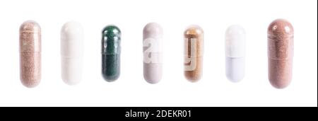 Capsule Set di integratori, vitamine e farmaci. Pillole di nutrizione, farmaci naturali sani. Macro isolato di vitamina C, spirulina e biotina Foto Stock