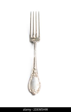 Antica forcella argentata isolata su sfondo bianco. Foto Stock
