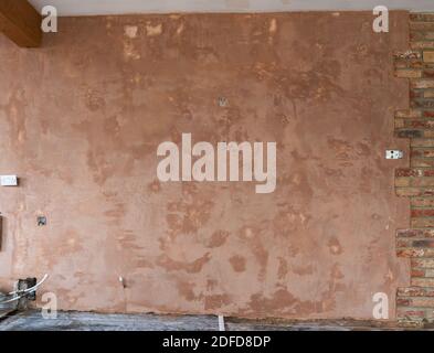 Intonacatura delle pareti, fondo marrone liscio Foto Stock