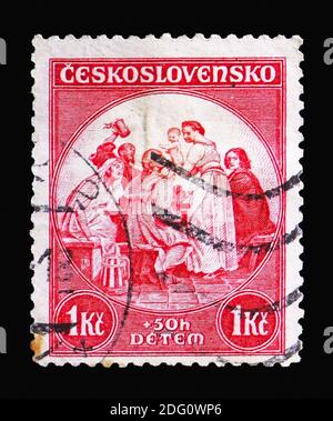 MOSCA, RUSSIA - 18 AGOSTO 2018: Un francobollo stampato in Cecoslovacchia mostra J.Manes: Gennaio dell'orologio astronomico della città vecchia, per i bambini serie, cir Foto Stock