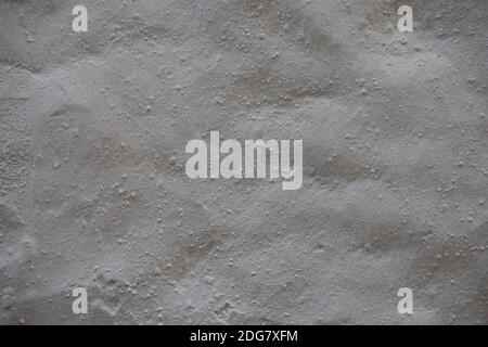 Fondo parete in cemento grigio con intonaco. Fondo struttura parete vecchio cemento, struttura superficie cemento di calcestruzzo, fondo in cemento grigio wal Foto Stock