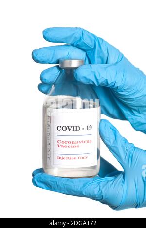 Vaccino Covid-19 bottiglia di vetro di Coronavirus in mano medica. Foto Stock