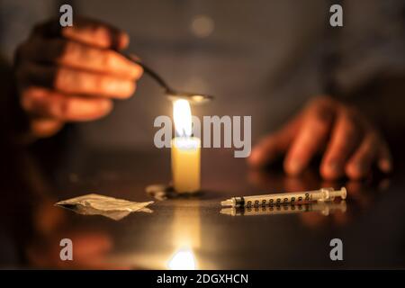Iniezione, candela ed eroina Foto Stock