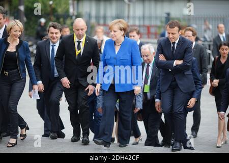 Il presidente francese Emmanuel Macron, di destra, e la cancelliera tedesca Angela Merkel, di centro a destra, arrivano a visitare l'Ufficio della gioventù franco-tedesco (OFAJ) a Parigi, Francia, giovedì 13 luglio 2017. Foto di Matthieu Alexandre/piscina/ABACAPRESS.COM Foto Stock