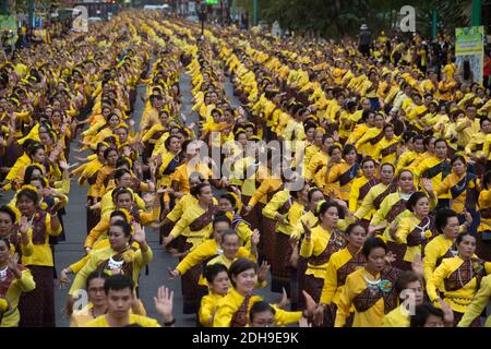 Grouping with a large of unidentified peoples are folk Dance to worship the Khon Kaen City Pillar Shrine on the  celebration of International silk . Stock Photo