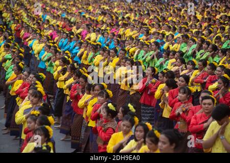 Grouping with a large of unidentified peoples are folk Dance to worship the Khon Kaen City Pillar Shrine on the  celebration of International silk . Stock Photo