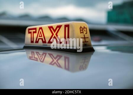 Segno di taxi a Hong Kong Foto Stock