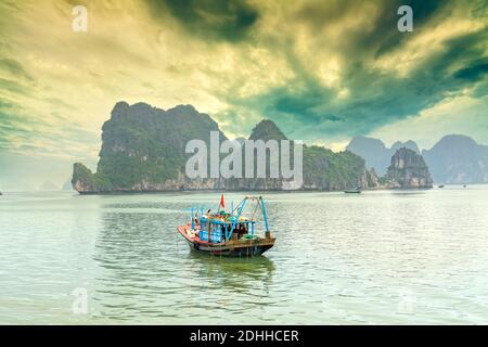 Dreamy sunset among the rocks of Halong Bay, Vietnam, This is the UNESCO World Heritage Site, it is a beautiful natural wonder in northern Vietnam Stock Photo