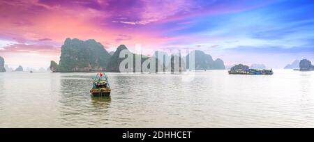 Dreamy sunset among the rocks of Halong Bay, Vietnam, This is the UNESCO World Heritage Site, it is a beautiful natural wonder in northern Vietnam Stock Photo